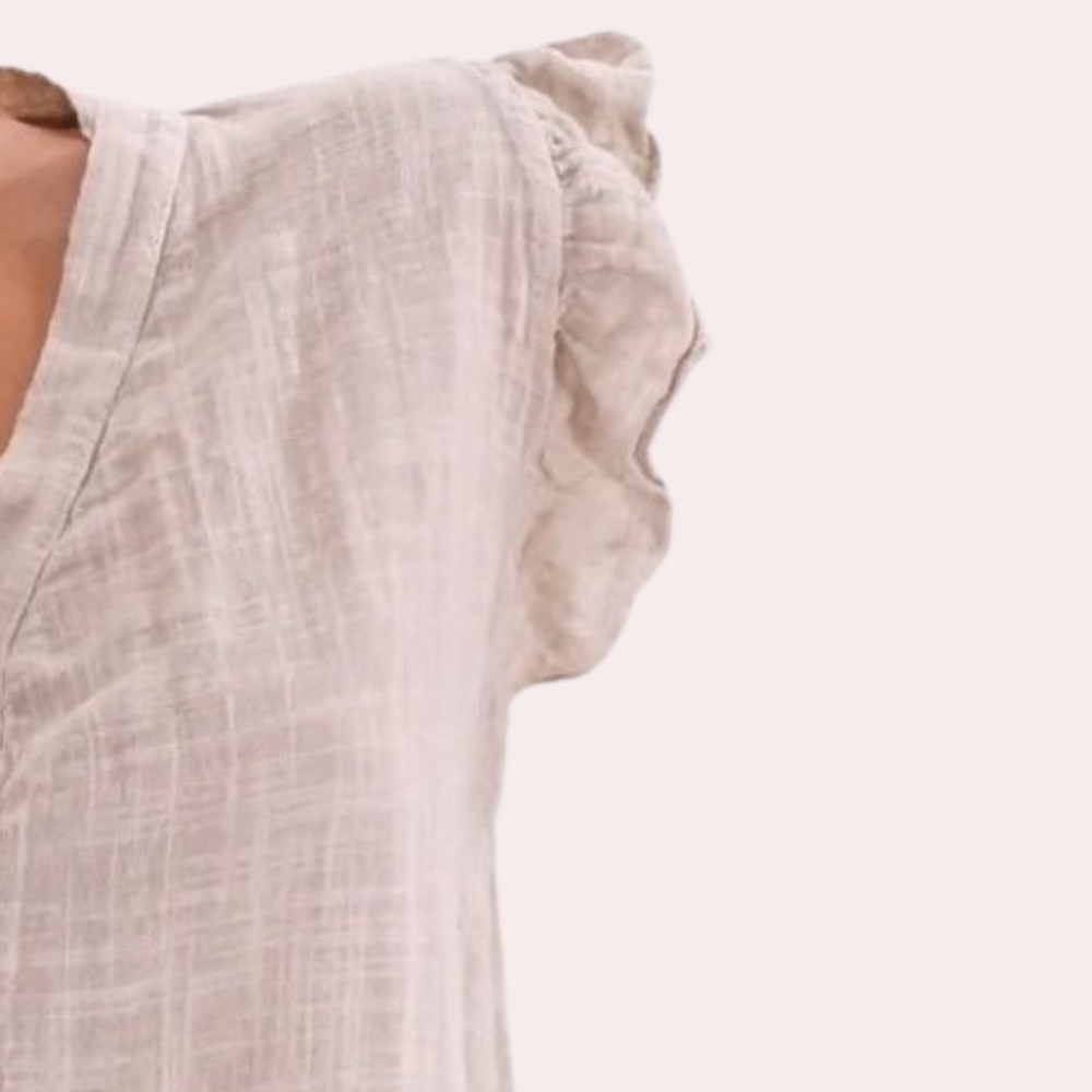 Elegant, loose-fitting women's blouse with striking pointed neckline