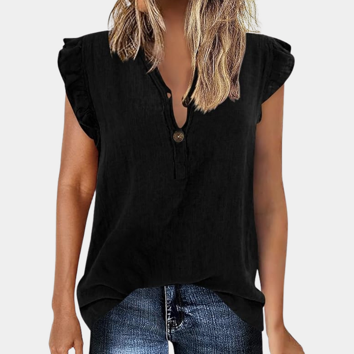 Elegant, loose-fitting women's blouse with striking pointed neckline