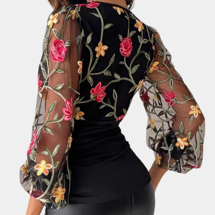 Stylish women's blouse with subtle floral embroidery