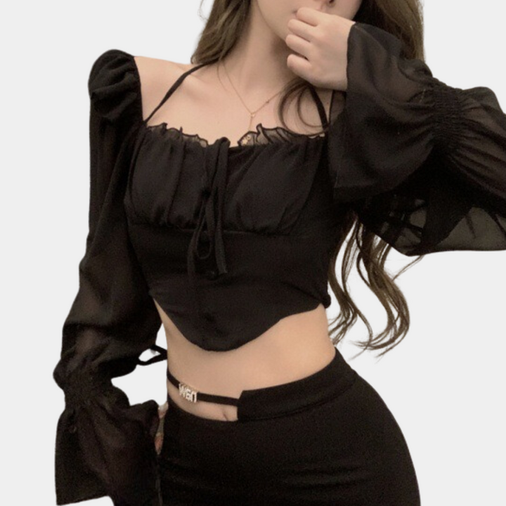 Elegant women's top with fashionable open shoulders