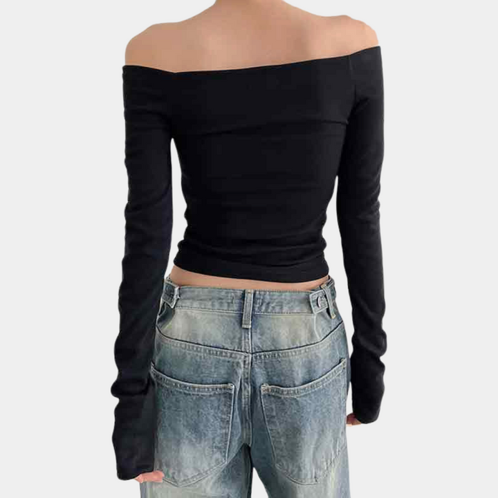 Stylish women's summer blouse with long sleeves and striking open shoulders