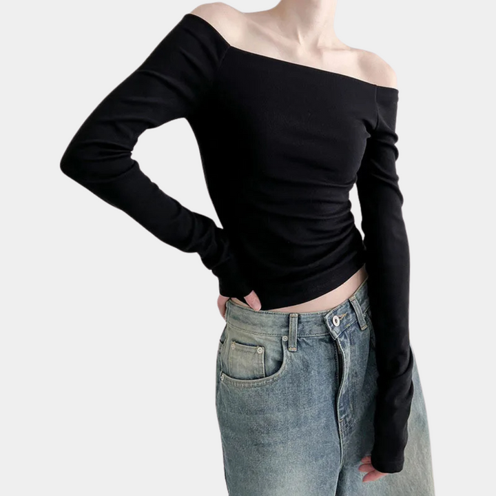 Stylish women's summer blouse with long sleeves and striking open shoulders