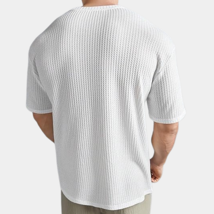 A stylish and comfortable men's shirt, perfect for moments of relaxation.