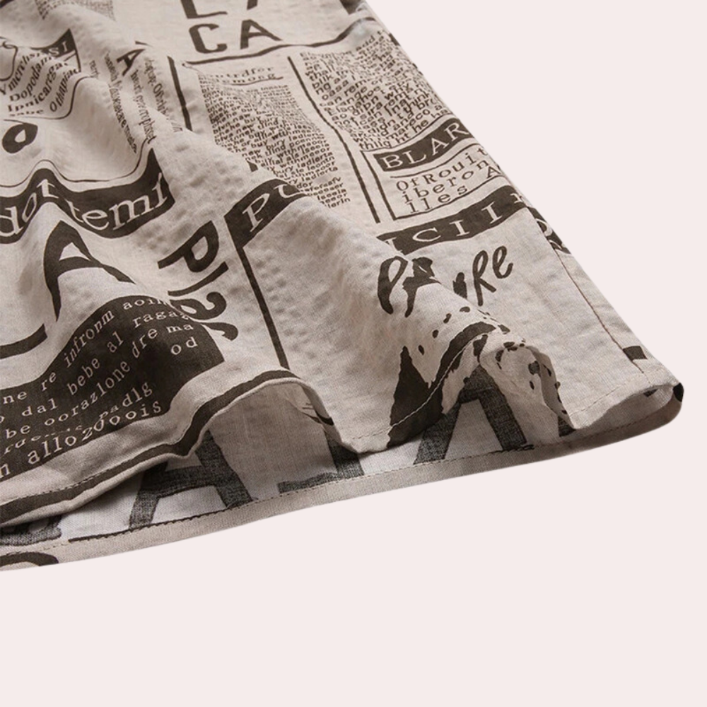 Stylish men's Bartosz T-shirt with unique newspaper-inspired print