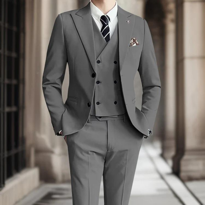 Patrik's elegant three-piece suit provides a sophisticated look