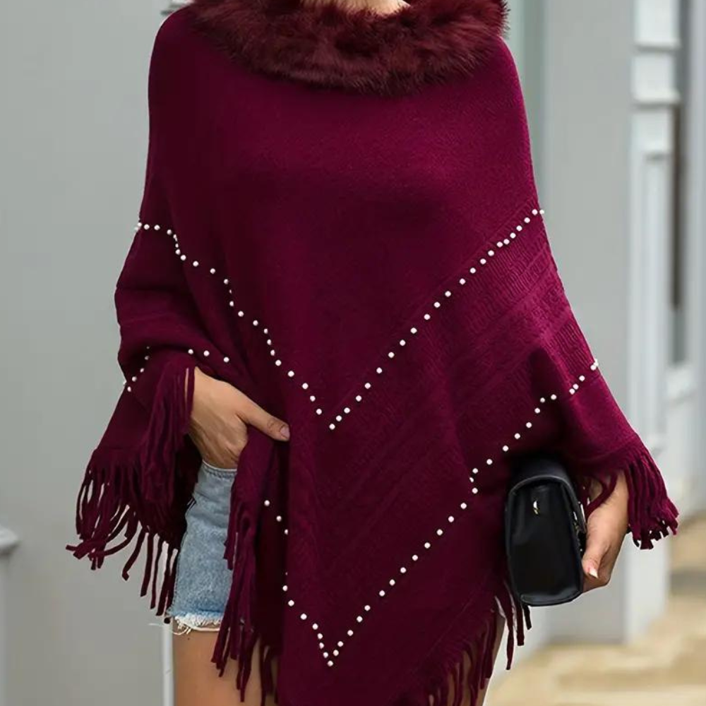 Eftychia's elegant knitted poncho with unique details for modern women