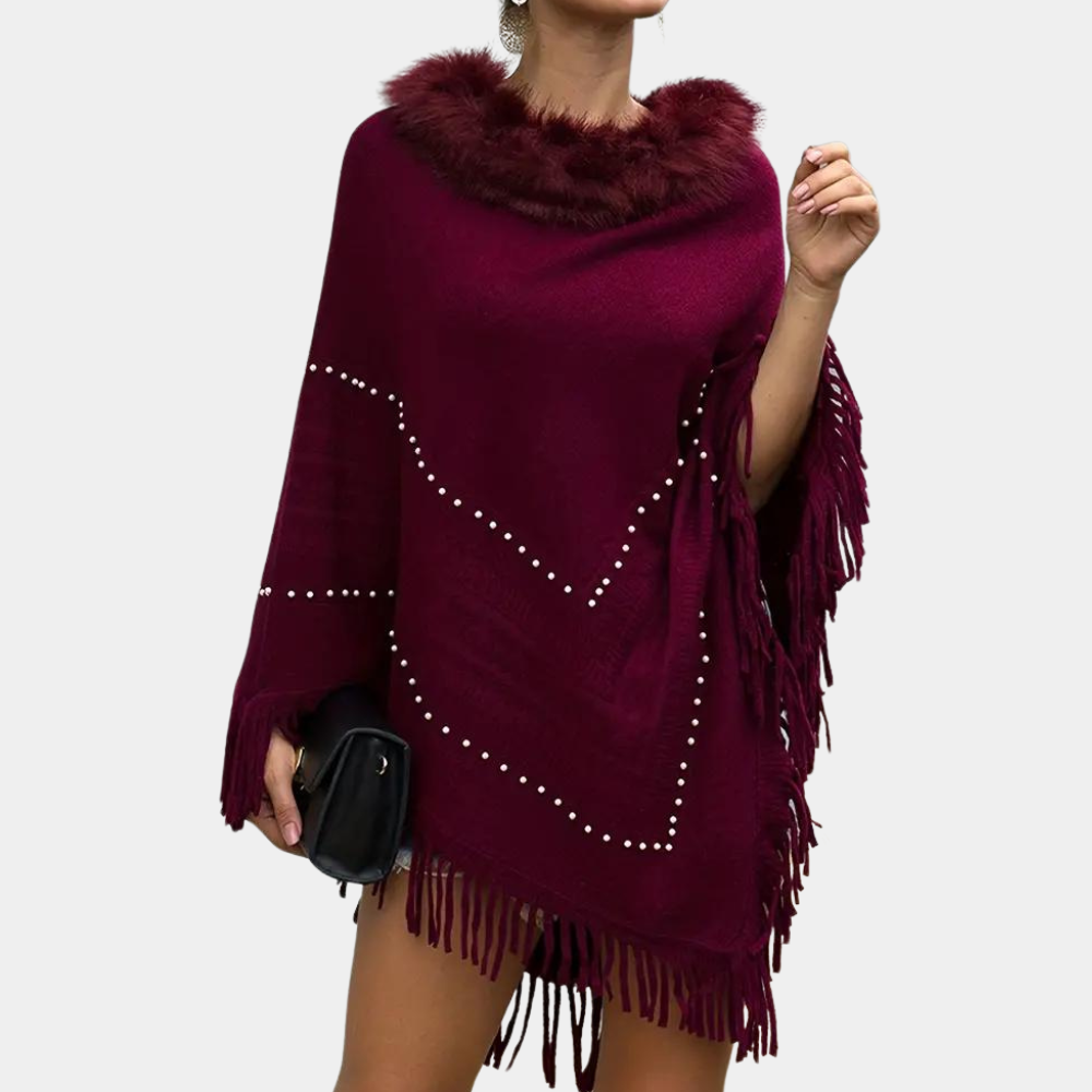 Eftychia's elegant knitted poncho with unique details for modern women