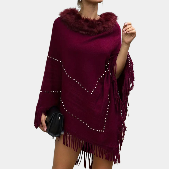 Eftychia's elegant knitted poncho with unique details for modern women