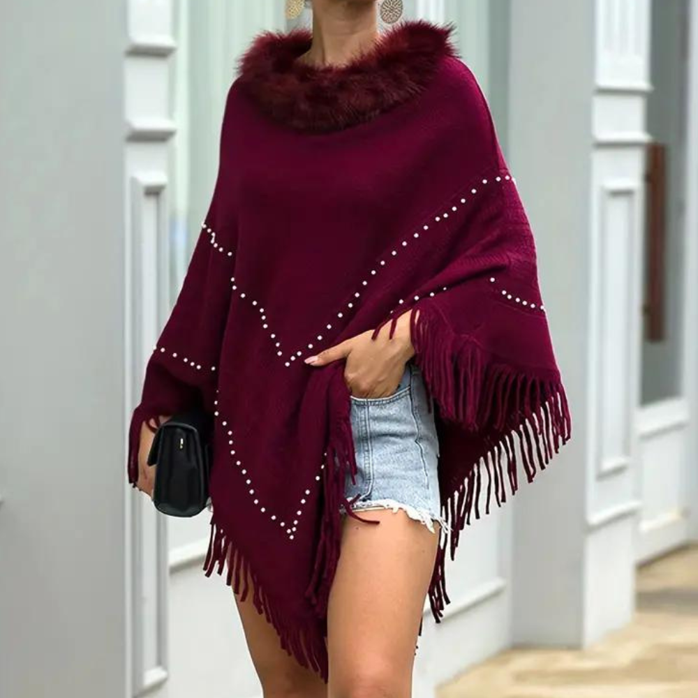 Eftychia's elegant knitted poncho with unique details for modern women